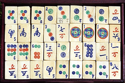 A Chinese Mahjong set, early 20th century, with bone and bamboo tiles,  contained within a five drawe
